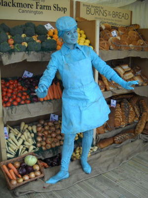 Turquoise Shopkeeper Living Statue